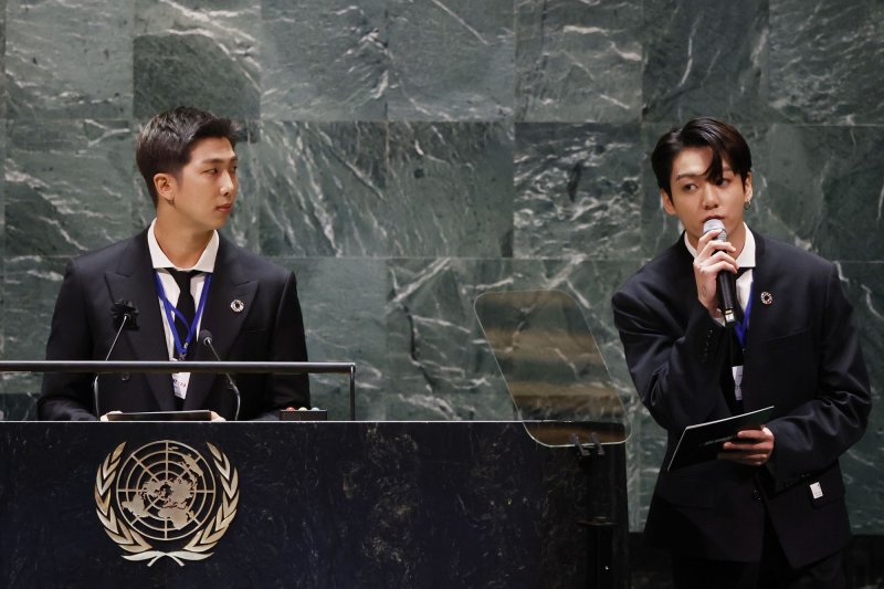 RM listens as Jungkook of the South Korean boy band BTS speaks at the SDG Moment event as part of the UN General Assembly 76th Session at the United Nations Headquarters on Monday. Photo by John Angelillo/UPI | <a href="/News_Photos/lp/498085b281ef9457502b48ecd4d56f51/" target="_blank">License Photo</a>