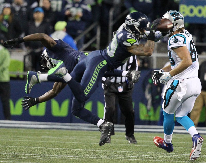 Seattle Seahawks safety Kam Chancellor collides with teammate Earl Thomas during a near interception while covering Carolina Panthers tight end Greg Olsen during a game in 2016. Photo by Jim Bryant/UPI