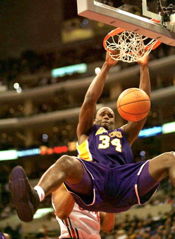 Shaquille O'Neal slams the ball during a game against the Los Angeles Clippers at the Staples Center on January 4, 2000. Photo by Sinartus Sosrodjojo/UPI
