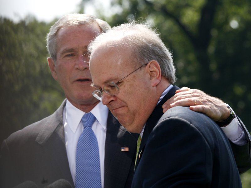 Former U.S. President George W. Bush hugs outgoing White House Deputy Chief of Staff Karl Rove after Rove announced his resignation at the White House in Washington, Aug. 13, 2007. (UPI Photo/Aude Guerrucci/POOL)