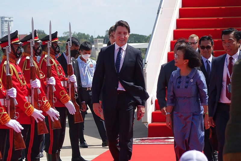 Canada's Prime Minister Justin Trudeau (C) arrives at Ngurah Rai International airport in Denpasar on the Indonesian island of Bali on Monday on the sidelines of the G20 Summit. During his trip, Trudeau announced military assistance for Ukraine and sanctions against nearly two dozen Russians. Photo by Canada's Prime Minister Press Office/ UPI