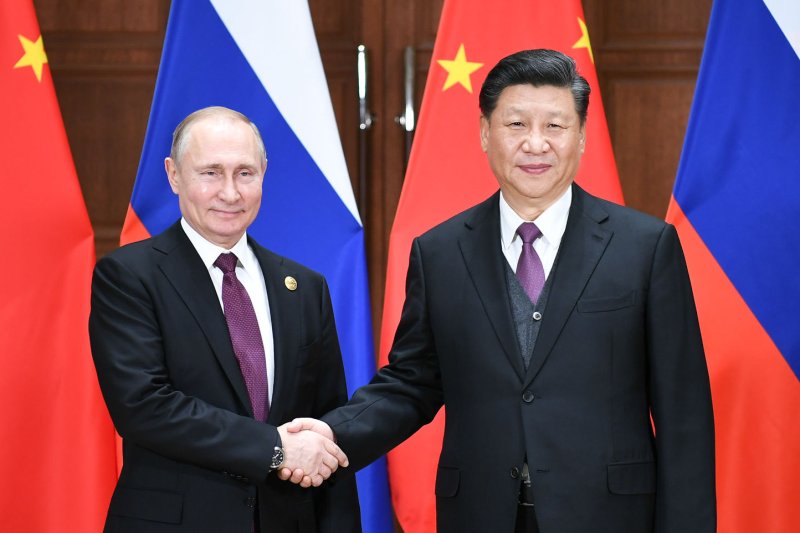 Russian President Vladimir Putin (L) and Chinese President Xi Jinping held a virtual summit Monday, according to Chinese state media. Pool Photo by Xie Huanchi/UPI