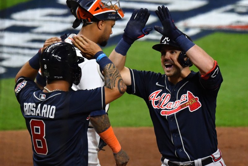 Atlanta Braves outfielder Adam Duvall (R) is congratulated by teammate Eddie Rosario after hitting a two-run home run against the Houston Astros during the third inning in Game 1 of the World Series at Minute Maid Park in Houston. Photo by Maria Lysaker/UPI
