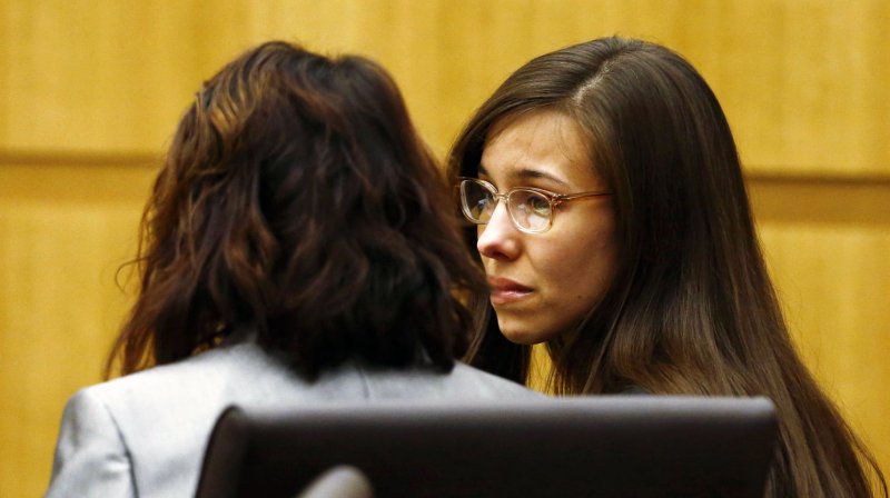 odi Arias (R) talks to one of her legal team after hearing the verdict of guilty of first degree murder in Phoenix, Arizona May 8, 2013. UPI// Rob Schumacher/Arizona Republic/Pool