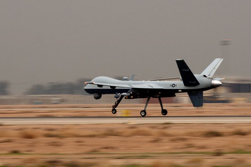 An MQ-9 Reaper unmanned aerial vehicle comes in for a landing. Reapers are remotely piloted and can linger over battlefields, providing persistent strike capabilities to ground force commanders. (UPI/Erik Gudmundson/U.S. Air Force) | <a href="/News_Photos/lp/6d2929a62c5252b7f466f9d02412d340/" target="_blank">License Photo</a>