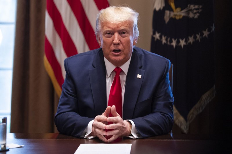 President Donald Trump on Wednesday signed a coronavirus aid bill as Congress and the White House began working on a third piece of legislation to provide relief to Americans amid the COVID-19 outbreak. Photo Kevin Dietsch/UPI
