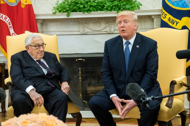 President Donald Trump speaks to reporters Tuesday after meeting with former Secretary of State Henry Kissinger in the Oval Office at the White House. Photo by Kevin Dietsch/UPI