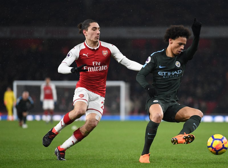 Arsenal's Hector Bellerin (L) and Manchester City's Leroy Sane (R) in action during the English Premier League soccer match between Arsenal FC and Manchester City Thursday at the Emirates Stadium in London, Britain. Photo by Neil Hall/EPA-EFE