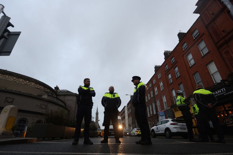 Police officers stand near the scene following a serious incident near Parnell Street East in Dublin, Ireland on Thursday. A man has been detained after allegedly five people, among them three children, near a school in central Dublin, police said. Photo by Mostafa Darwish EPA-EFE/