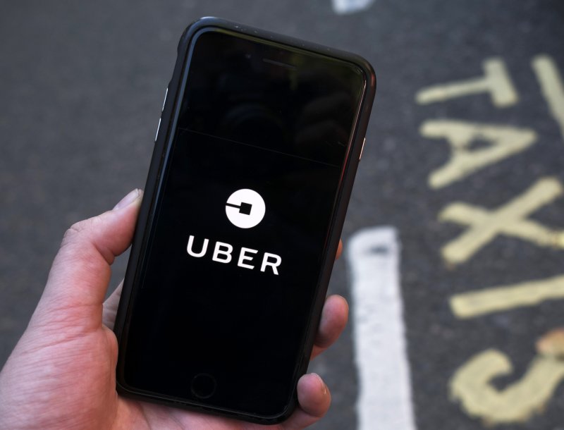Uber has sued New York City over capping new licenses awarded drivers of ride-hailing services, an attempt by the city to reduce congestion and help taxi drivers. File photo by Will Oliver/EPA