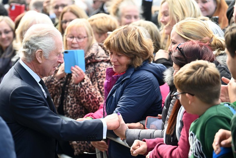 Britain's King Charles III (L) greets people in London on September 17. Wednesday in York a protester threw eggs at the king and the queen consort. The eggs missed and North Yorkshire Police said they arrested a 23-year-old, who remains in custody. Photo by Neil Hall/EPA-EFE