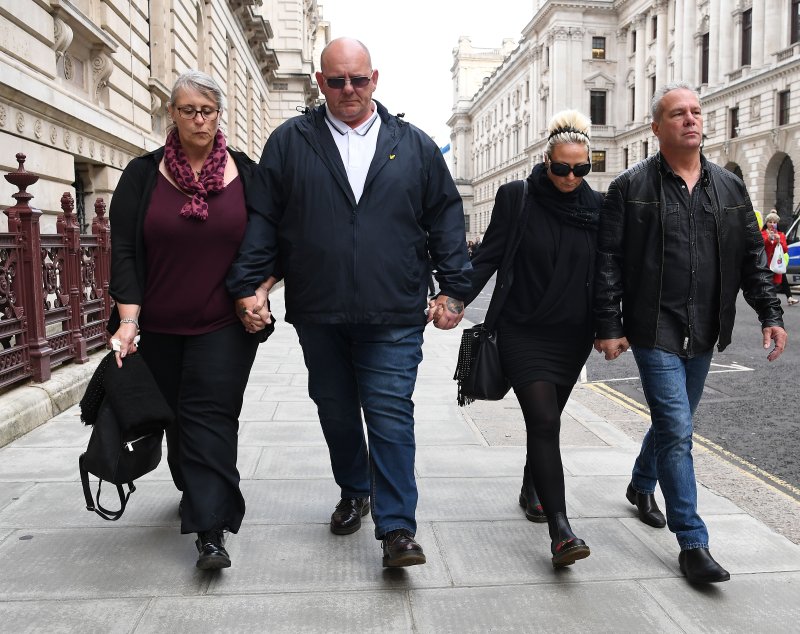 The family of Harry Dunn leave the Foreign Office in London, Britain, on October 9, 2019, after meeting with British Foreign Secretary Dominic Raab. The family is asking for justice after their son Harry was killed in a traffic accident involving Anne Sacoolas, the wife of a U.S. diplomat. File Photo by Andy Rain/EPA-EFE