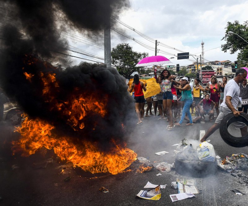 Protesters burn tires during a violent demonstration against a military police strike in Vitória, the capital of Brazil's Espírito Santo state, on February 7. File Photo by Gabriel Lordello/EPA