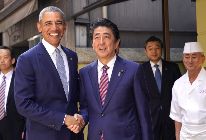 Former U.S. President Barack Obama warned North Korea's nuclear weapons program is "a real threat" during a visit Sunday to Japan in which he also met Prime Minister Shinzo Abe for lunch at a sushi restaurant. Photo by Shizuo Kambayashi/EPA