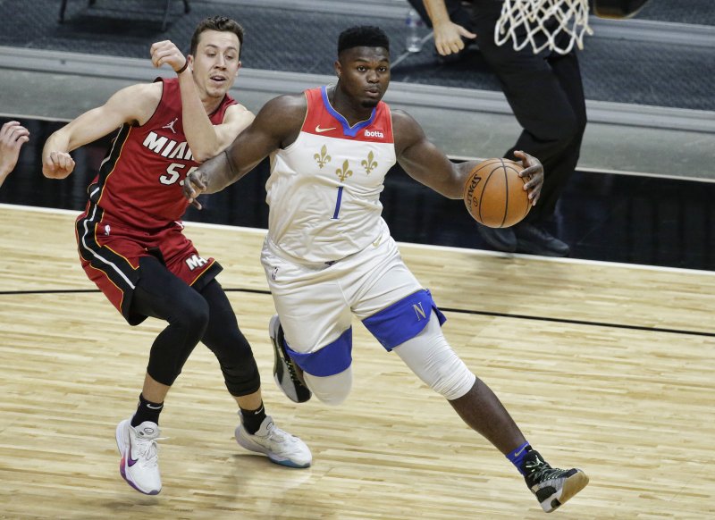 New Orleans Pelicans forward Zion Williamson (R), shown Dec. 25, 2020, has yet to play this season due to the foot injury. File Photo by Rhonda Wise/EPA-EFE