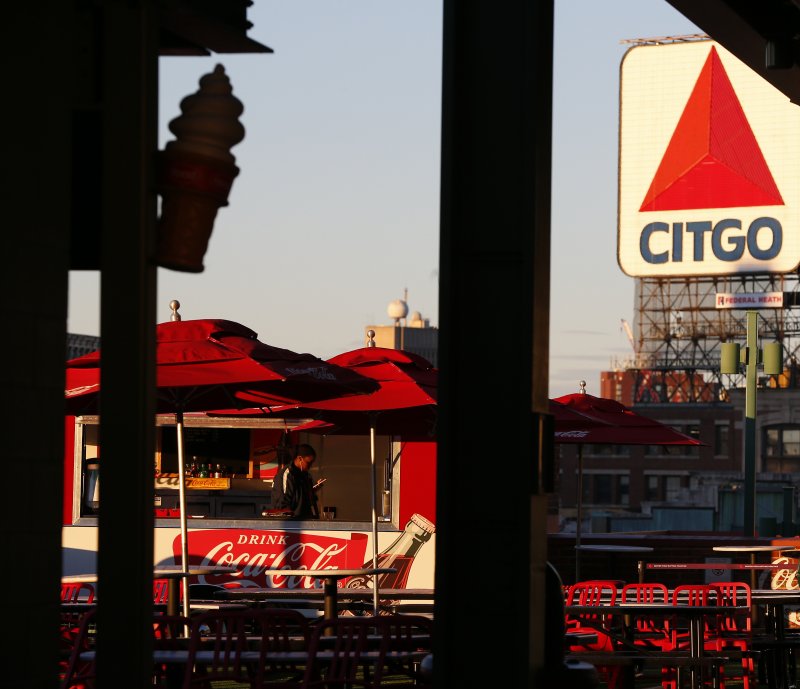 The iconic Citgo sign is seen beyond the outfield at Fenway Park in Boston on October 13, 2018. Citgo Petroleum Corp. is the refining arm of Petroleos de Venezuela SA, or PDVSA, the state-run oil company. Photo by CJ Gunther/EPA