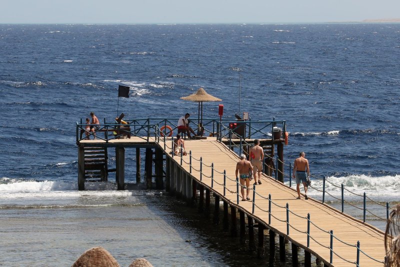 Tourists spend time at the beach at a leisure resort on the Red Sea in Egypt on September 26, 2020. File Photo by Khaled Elfiqi/EPA-EFE