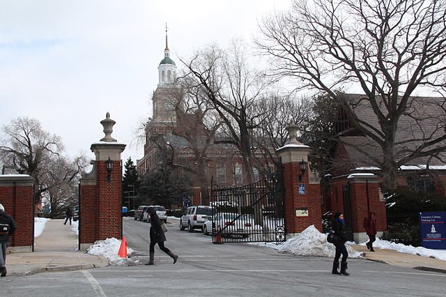 The Howard University gate and Founders Library are shown. File Photo by Fourandsixty/Wikimedia Commons
