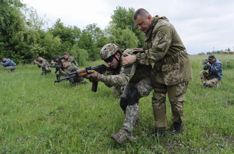 Ukrainian civilians take part in tactical training in the Western Ukrainian city of Lviv, Ukraine, to learn military skills amid the Russian invasion. On Thursday, Britain announced it will be sending additional lethal supplies to the war-torn country. File photo by Mykola Tys/EPA-EFE