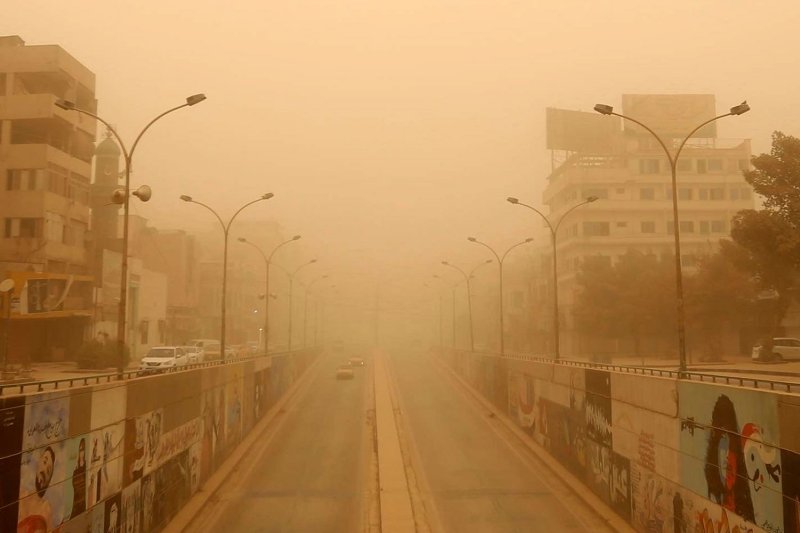 Cars drive along a street during a sandstorm in Baghdad, Iraq, on Thursday. Photo by Ahmed Jalil/EPA-EFE