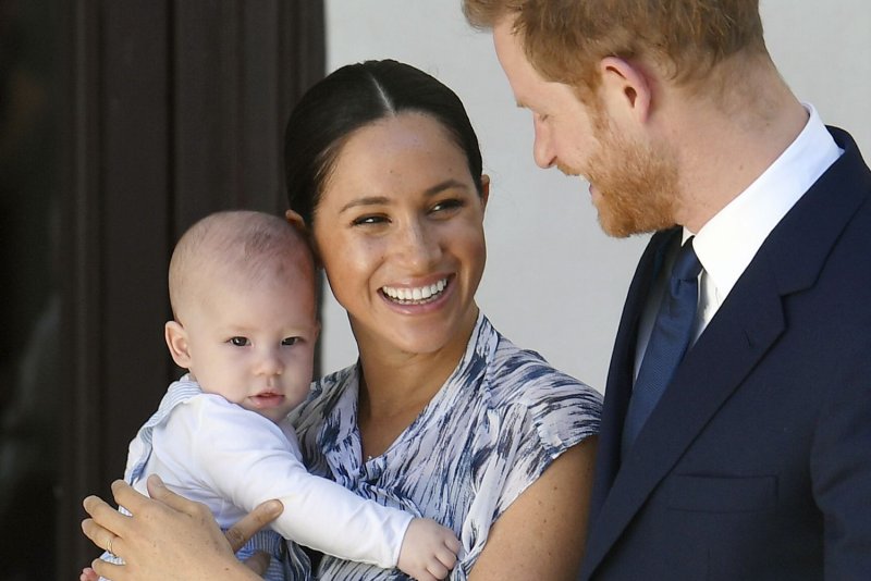 Britain's Prince Harry and his wife Meghan hold their son Archie in September 2019 at the Desmond and Leah Tutu Legacy Foundation in Cape Town, South Africa.  File photo by Toby Melville/EPA-EFE