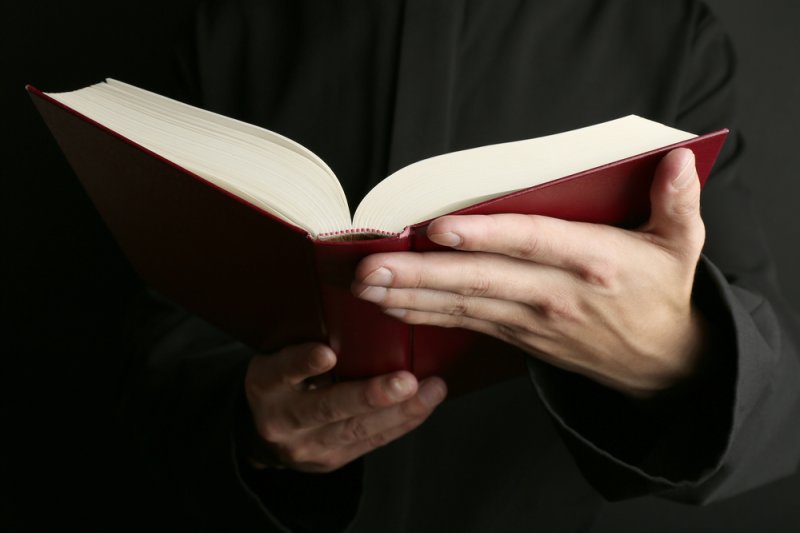 A man reads a Bible. (UPI/Shutterstock/Africa Studio)