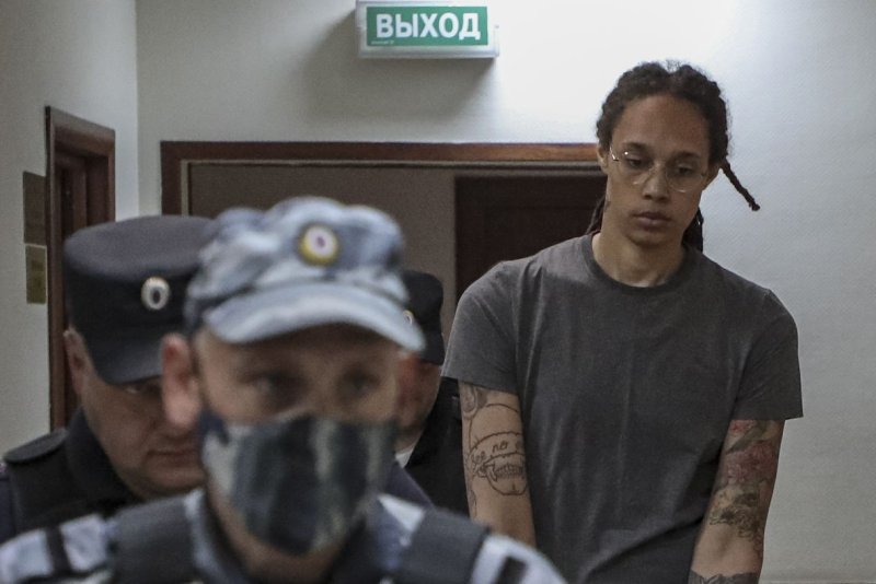 Two-time Olympic gold medalist and WNBA star Brittney Griner is escorted to a courtroom for a hearing in August. The 32-year-old American was transferred to a Russian penal colony on Wednesday to serve a nine-year sentence after an appeals court upheld the sentence for drug smuggling in October. File photo by Maxim Shipenkov/EPA-EFE