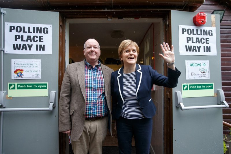 Former Scottish National Party leader Nicola Sturgeon (R) told reporters Saturday she will continue to cooperate in the police investigation of her husband Peter Murrell (L). File Photo by Robert Perry/EPA-EFE