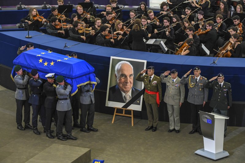 The coffin of late former German Chancellor Helmut Kohl is carried to the European Parliament as current and past world leaders gather for the ceremony honoring him in Strasbourg, France, on Saturday. Kohl, widely regarded as the father of German reunification in 1990, died June 16 at his home in Ludwighshafen, Germany. Photo by Fred Marvaux/EPA