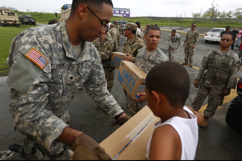 Members of the U.S. Army deliver supplies to the people affected by Hurricane Maria, in Las Piedras, Puerto Rico, on October 18. Photo by Thais Llorca/EPA-EFE
