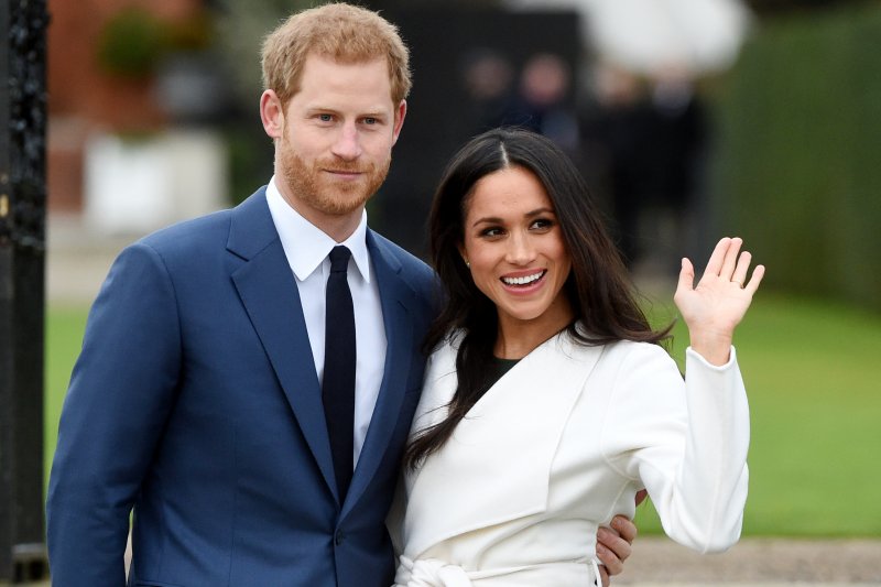 Meghan Markle (R), pictured with Prince Harry, was an actress and activist prior to meeting the British royal. Photo by Facundo Arrizabalaga/EPA-EFE