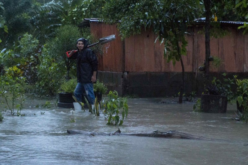 A man walks in floodwaters after the passing of Tropical Storm Nate in Rivas, Nicaragua, on Thursday. At least 22 people have died in Central America from the storm, 11 of them in Nicaragua. Photo by Jorge Torres/EPA-EFE