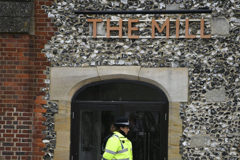 Police stand near a pub in Salisbury, Britain, on Sunday where an investigation into the poisoning of a former Russian spy is ongoing. Photo by Neil Hall/EPA-EFE