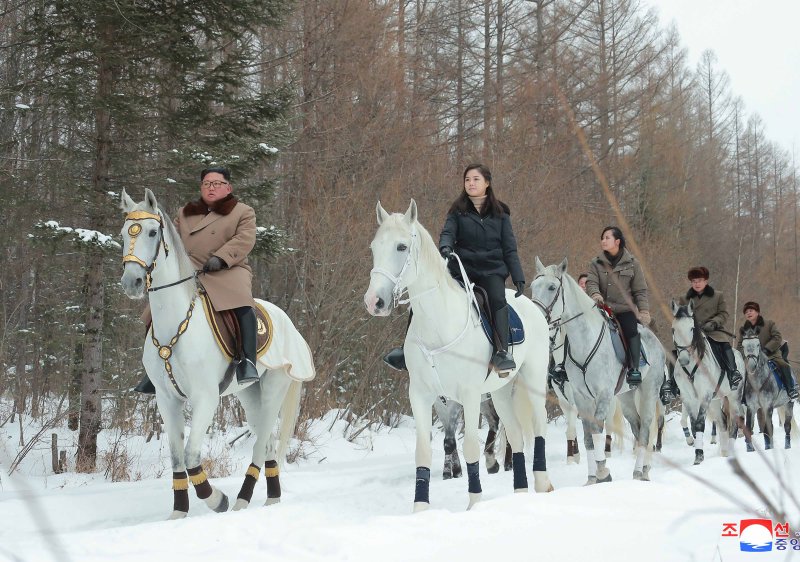 A photo released by the official North Korean Central News Agency (KCNA) on Tuesday shows, from left to right, North Korean leader Kim Jong Un, his wife, Ri Sol-ju, and his sister Kim Yo-jong during a horseback ride through a snow-covered scenery in North Korea.&nbsp; Photo by KCNA/EPA-EFE
