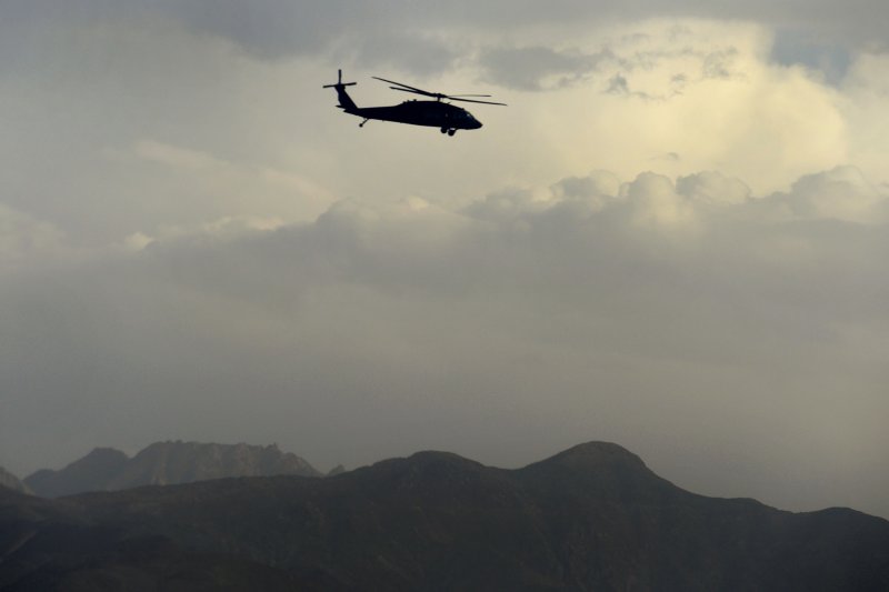A U.S. Army UH-60 Black Hawk helicopter carrying U.S. Deputy Secretary of Defense Ash B. Carter flies over a mountain range in Afghanistan in 2013. File Photo by Glenn Fawcett/Department of Defense