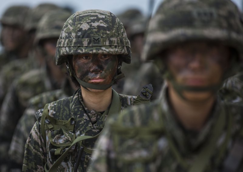 A Republic of Korea Marine stands in formation during Exercise Cobra Gold 2014 at Hat Yao beach, Rayong, Thailand. Cobra Gold is a multinational military training exercise that includes South Korea and the United States. Photo by Sgt. Matthew Troyer/U.S. Marine Corps