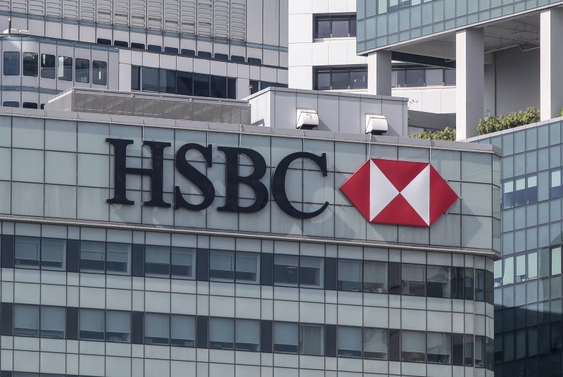 The HSBC logo on the side of its building in the financial district of Singapore, on March 9, 2016. The bank reported its net profits doubled in the first half of 2023. File Photo by Wallace Woon/EPA
