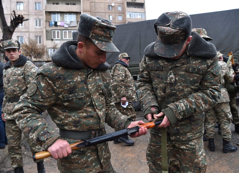 Armenian volunteers receive uniforms and weapons at a military commissariat to join the self-defense army of Nagorno-Karabakh in Yerevan, Armenia, on April 3. Now Armenia and Russia are working to establish of a single air defense system in the Caucasus region. Photo by Hayk Baghdasaryan/EPA/Photolure