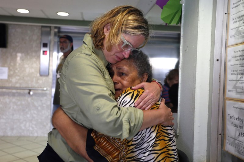 San Juan's Mayor Carmen Yulin Cruz (L) hugged a woman during her visit to an elderly home in San Juan, Puerto Rico, a couple days after Hurricane Maria made landfall last year. EPA-EFE/THAIS LLORCA