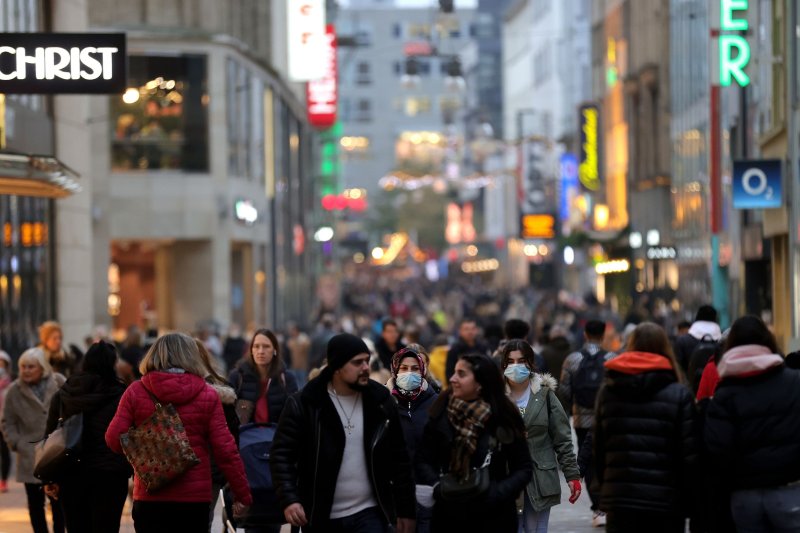 Shoppers walk on the Westenhellweg main shopping street in the city center of Dortmund, Germany, on November 19, 2021. Eurostat said inflation in the Eurozone eased in November. File Photo by Friedeman Vogel/EPA-EFE