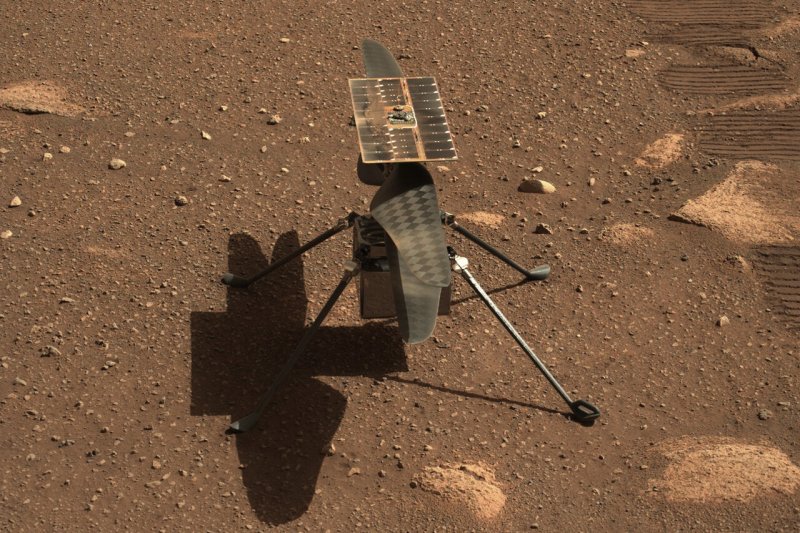NASA’s Mars helicopter Ingenuity is seen on the planet's surface on April 5, the 45th Martian day of the Perseverance rover mission. Photo courtesy of NASA