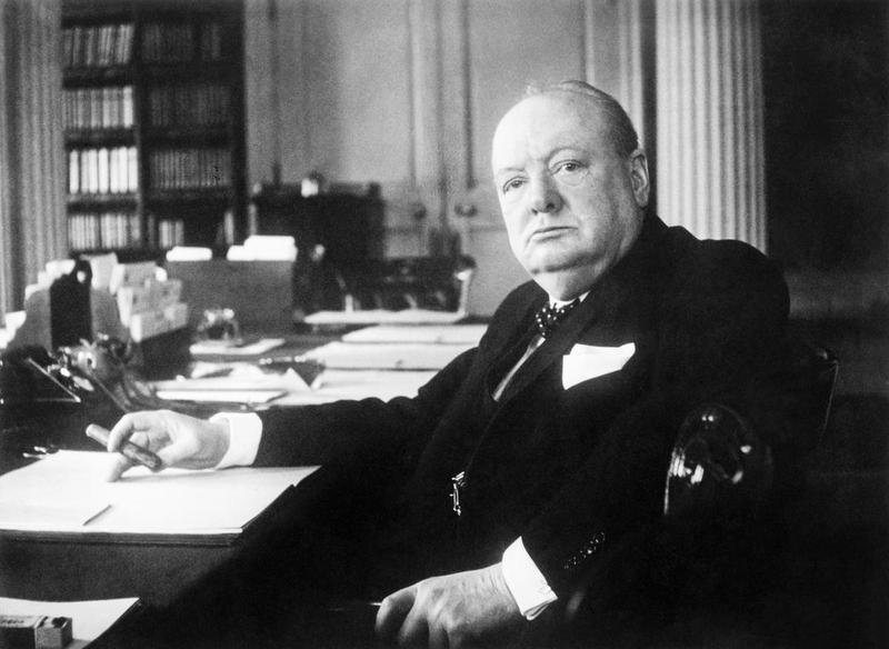 Portrait of Prime Minister Winston Churchill at his seat in the Cabinet Room at No. 10 Downing Street, London ca. File Photo courtesy Cecil Beaton/Imperial War Museums