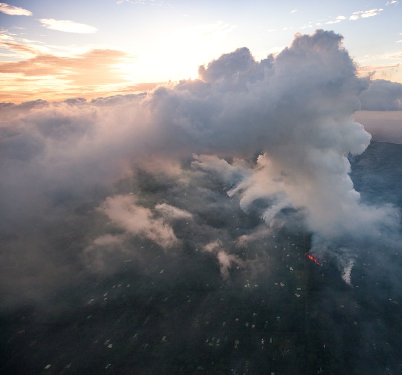 Plumes of gas and smoke over the east rift zone of the Kilauea volcano on Saturday. Officials say acid rain may pose a risk for nearby residents this week. Photo by Bruce Omori/EPA-EFE