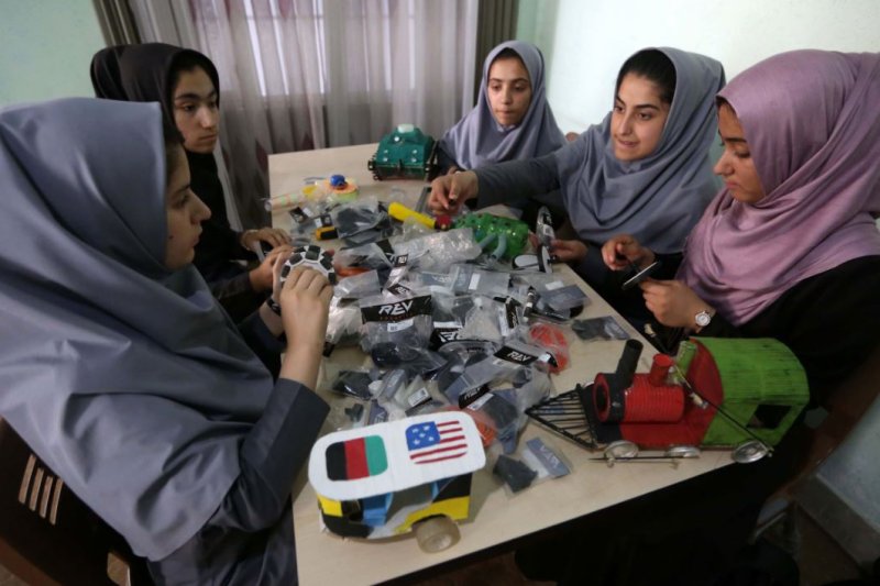 Afghan school girls work on a robot at a school in Herat, Afghanistan, on July 4, 2017. High schools for girls were supposed to reopen in Afghanistan on Wednesday, but the Taliban reversed their decision to do so. File Photo by Jalil Rezayee/EPA