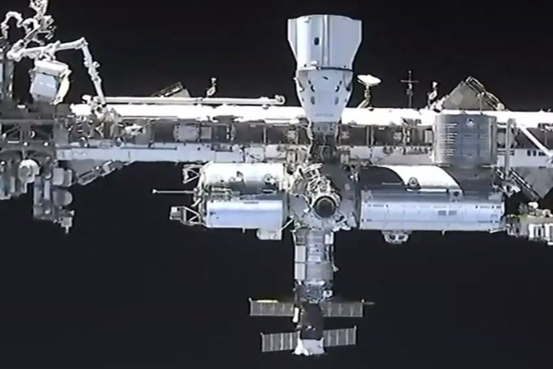 The SpaceX Dragon capsule Endeavour can be seen approaching the top of the International Space Station. The SpaceX Crew-4 mission's return home from the ISS was "waved off" Thursday due to weather concerns at the splashdown site, according to NASA and SPaceX. Photo courtesy of NASA