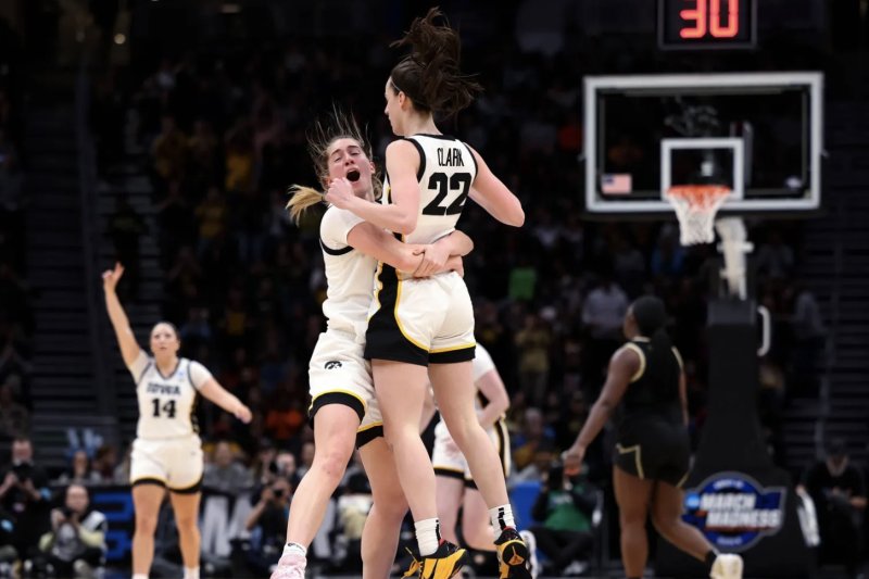 Iowa Hawkeyes guard Caitlin Clark (22) totaled 41 points, 12 assists and 10 rebounds in a win over Louisville in the Elite Eight of the 2023 NCAA Division I women's basketball tournament Sunday in Seattle. Photo by Brian Ray/HawkeyesSports.com