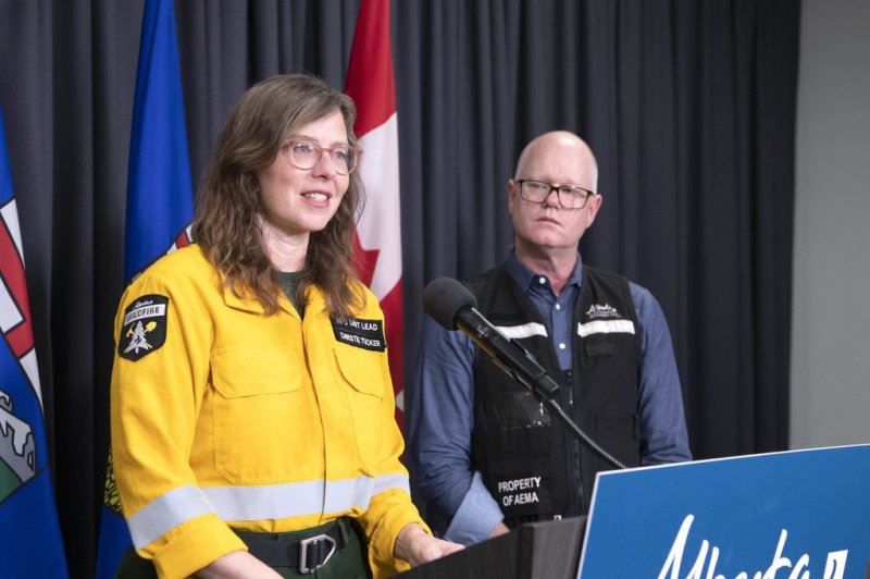 Christie Tucker, information unit manager, Alberta Wildfire, and Stephen Lacroix, managing director, Alberta Emergency Management Agency provide an update Friday on wildfires from Edmonton. Photo by Chris Schwarz/Government of Alberta