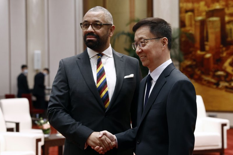 British Foreign Secretary James Cleverly (L) and Chinese Vice President Han Zheng shake hands ahead of their meeting Wednesday at the Great Hall of the People in Beijing. Cleverly later also met with the country's top foreign policy adviser Wang Yi. Photo by Florence Lo/EPA-EFE/Pool