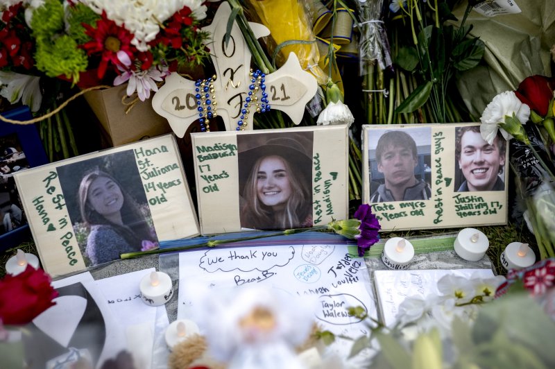 A memorial outside Oxford High School in Michigan grows in the days after four students were killed in a shooting. Photo by Nic Antaya/EPA-EFE