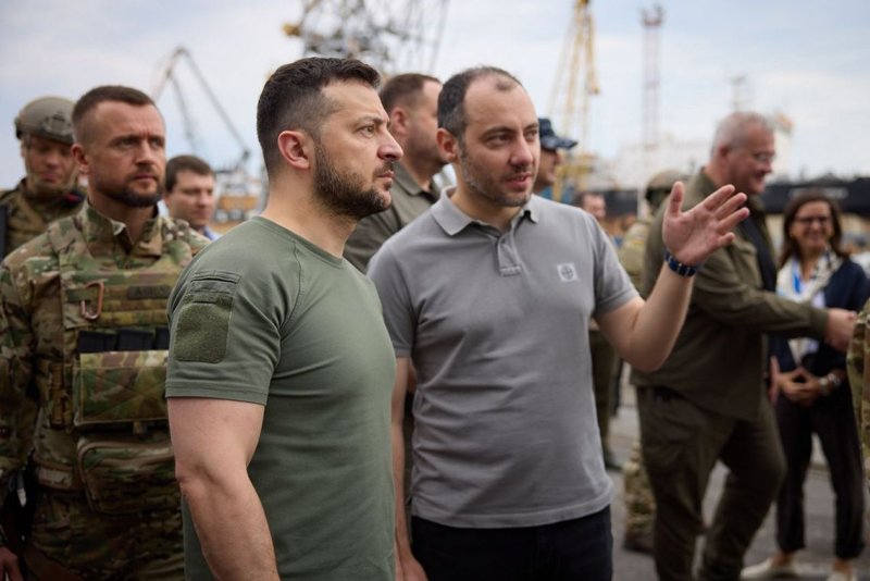 Ukrainian President Volodymyr Zelensky (L) warned citizens in Russia-occupied Crimea to stay away from Kremlin military installations after an apparent attack on a military depot on Tuesday. File Photo courtesy of the Ukrainian Presidential Press Service/EPA-EFE